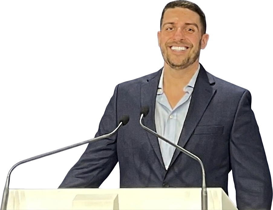 Connor King speaking at a podium